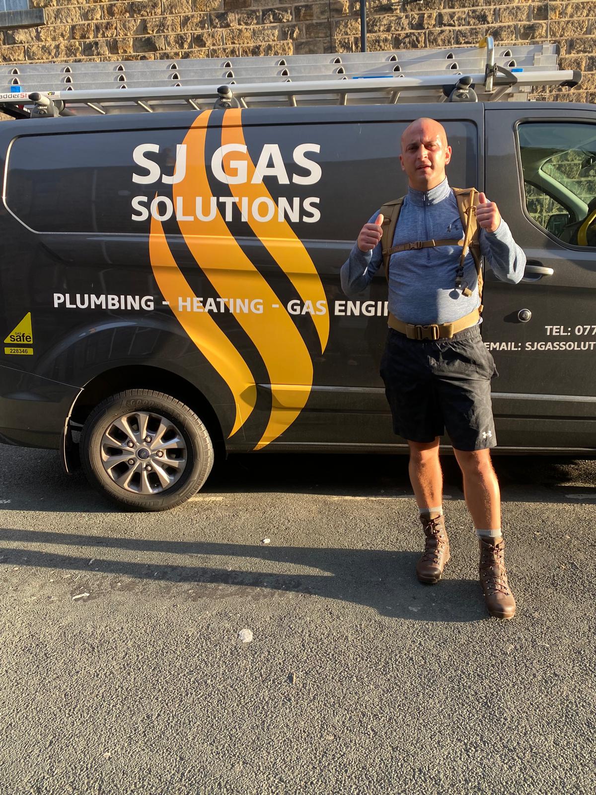Scott, founder of SJ Gas Solutions, standing in front of the SJ Gas Solutions van in Barnsley